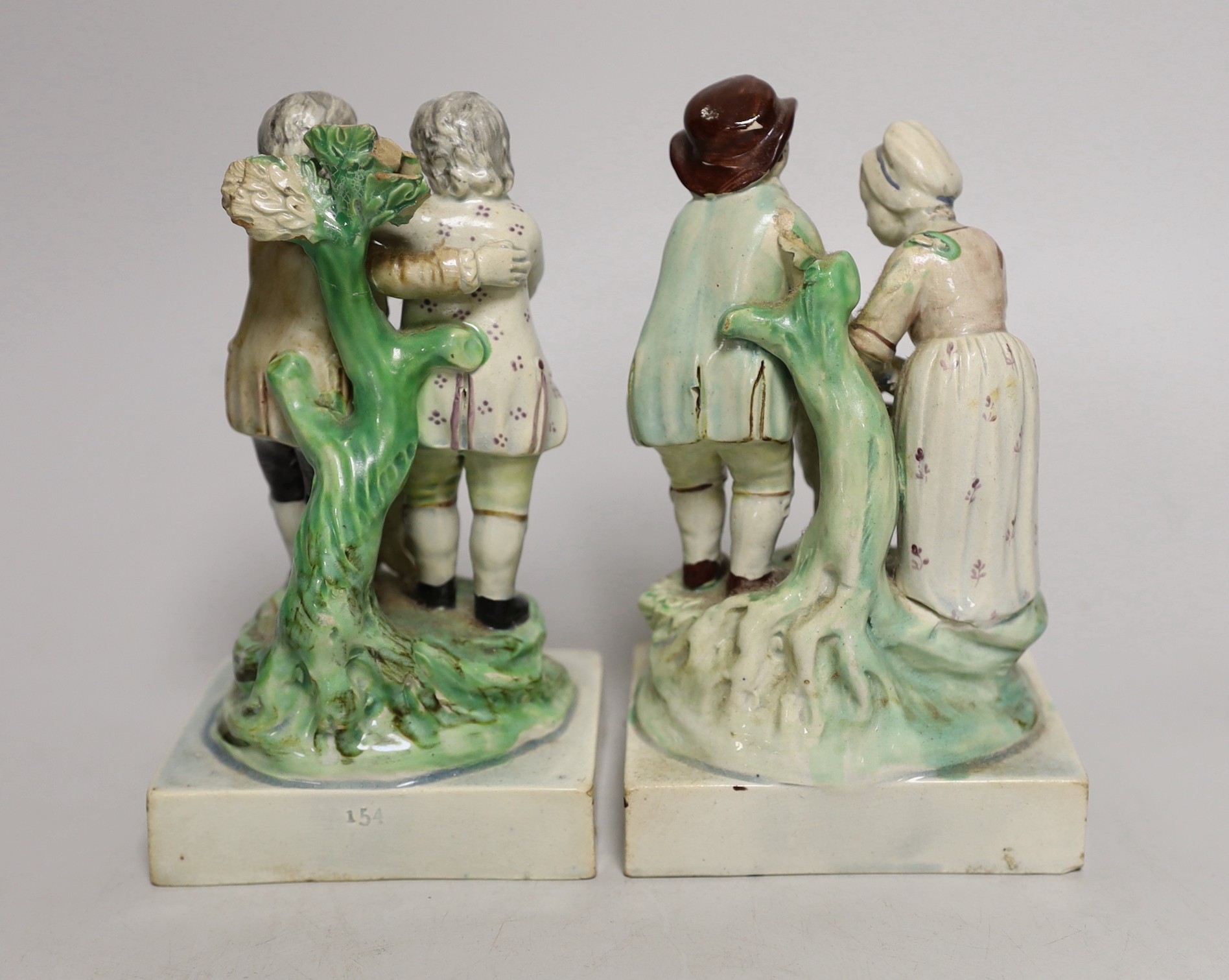 A pair of Ralph Wood pearlware groups Friendship and Tenderness, late 18th century, friendship with impressed number 154 to the back of the base, 16cm